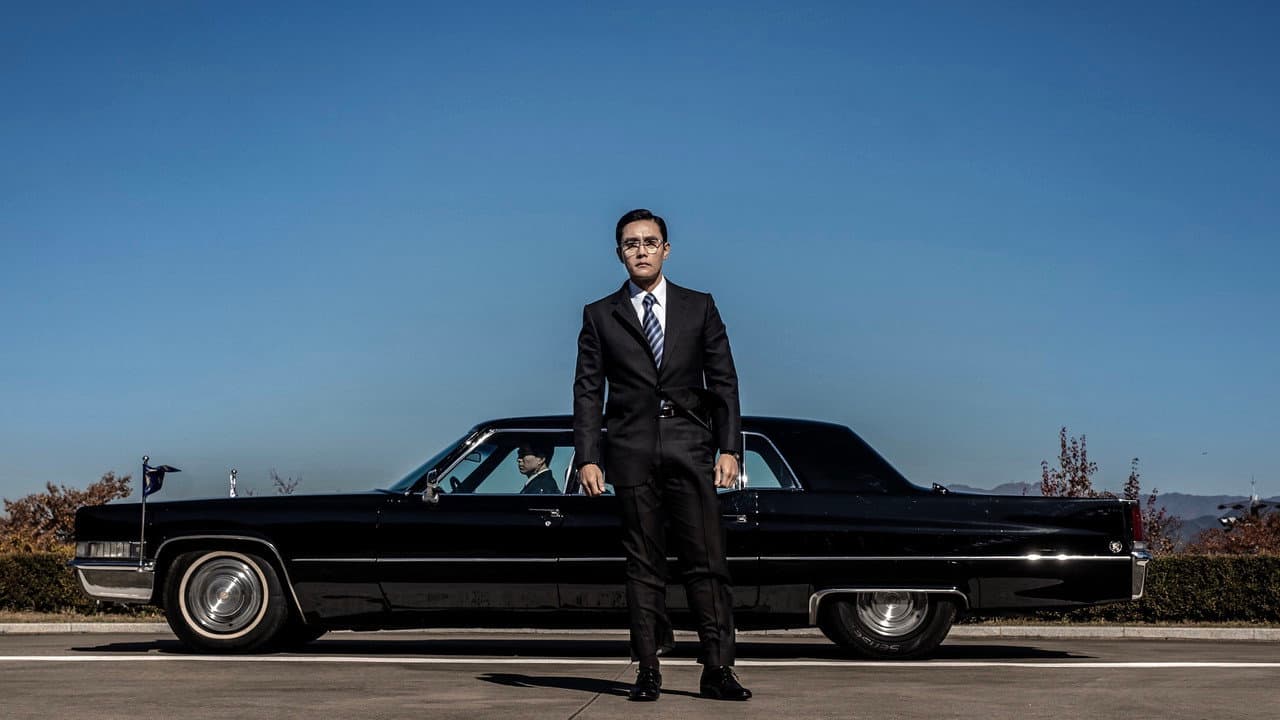 The Man Standing Next backdrop